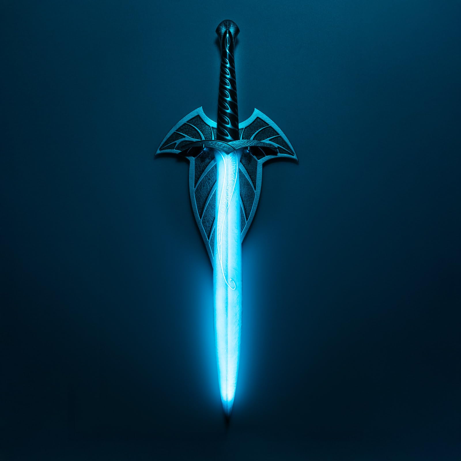Grupo Erik Sting Sword Lamp blue LED glow atop a desk for cozy nights.