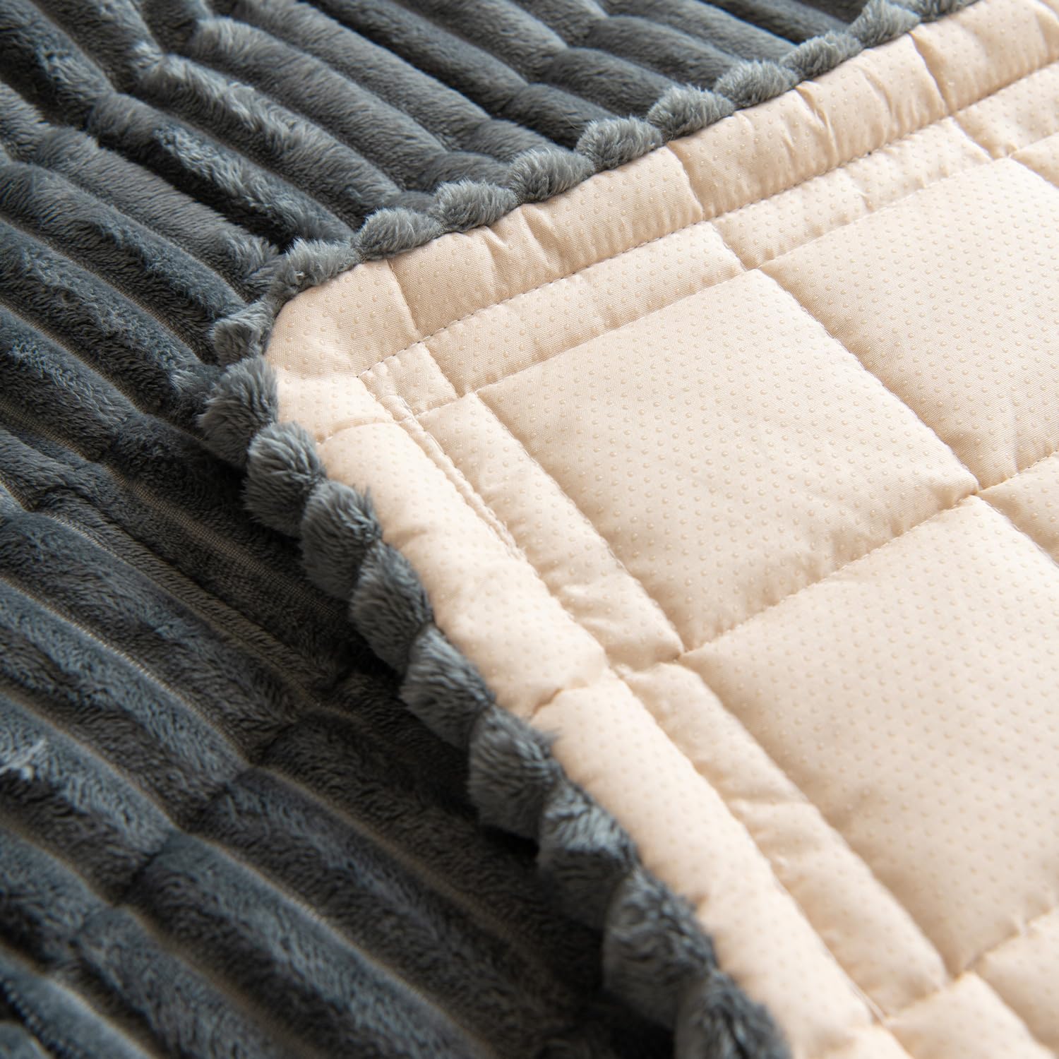 Easy-install Gumfolk slipcover shown draped over sofa for quick protection.