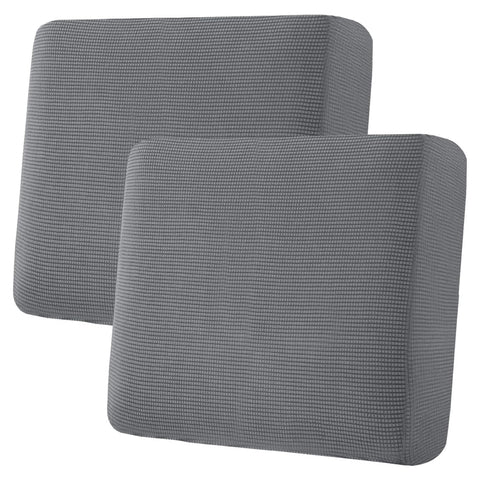 H.VERSAILTEX super stretch seat covers in grey on a sofa; 2-piece set protects cushions.