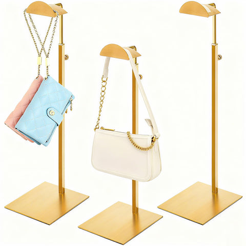 Hacaroa gold 3-pack purse display stands on shelf.