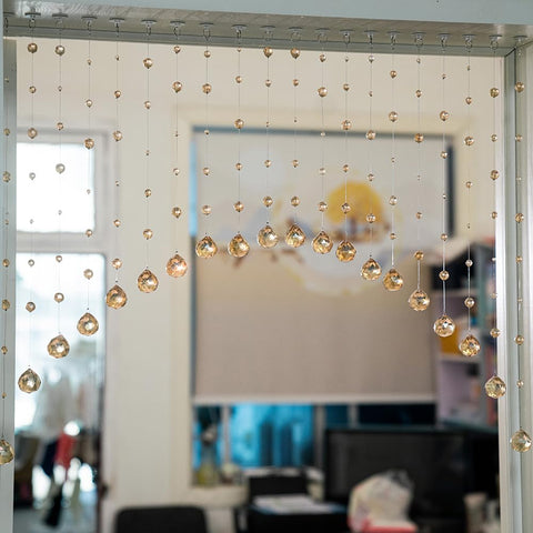 Hanbinsen arched doorway beads create a soft, reflective entry
