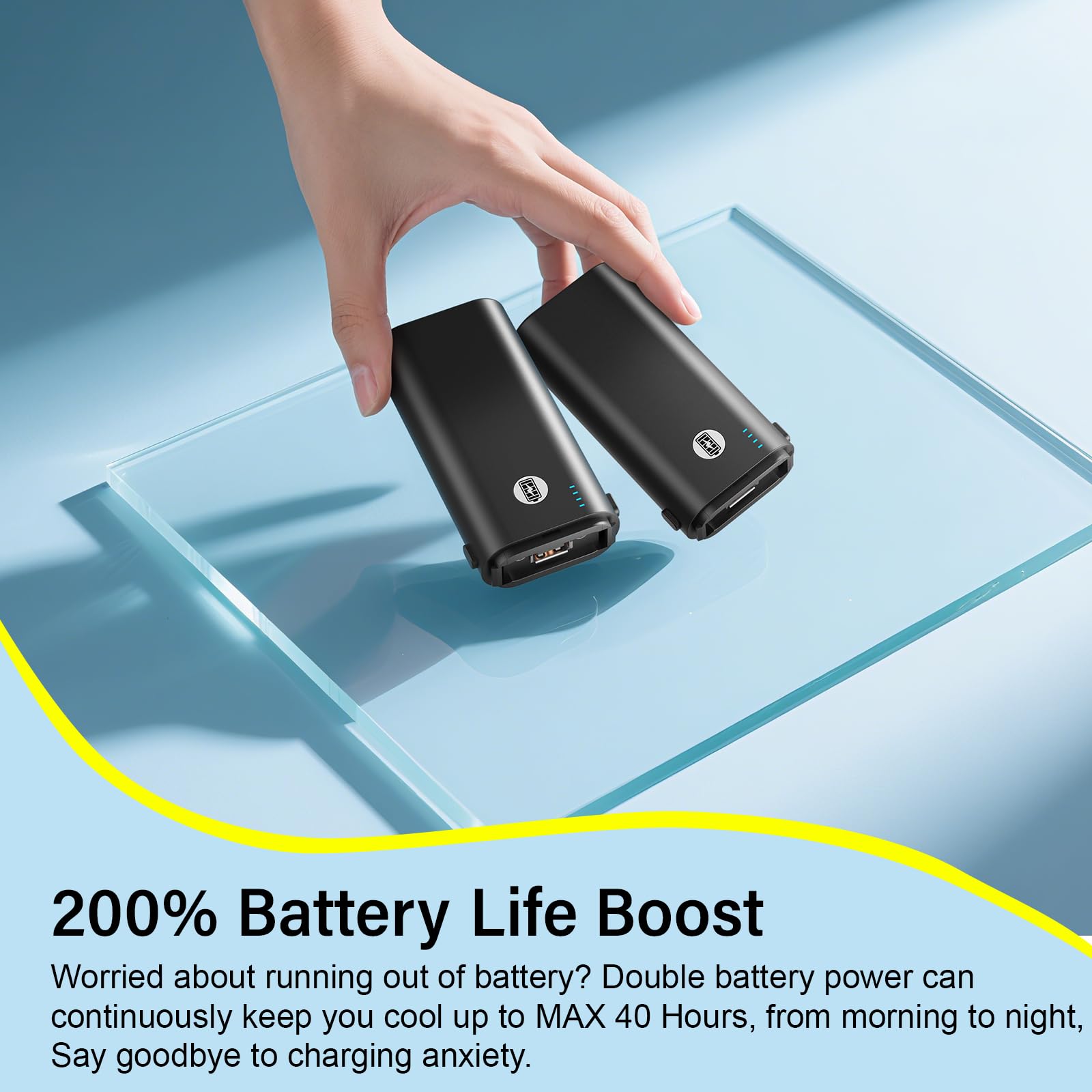 Foldable HandFan on desk with stand for hands-free cooling.