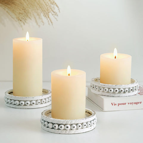 Hanobe three-piece pillar candle holders with whitewashed finish for cozy centerpieces.