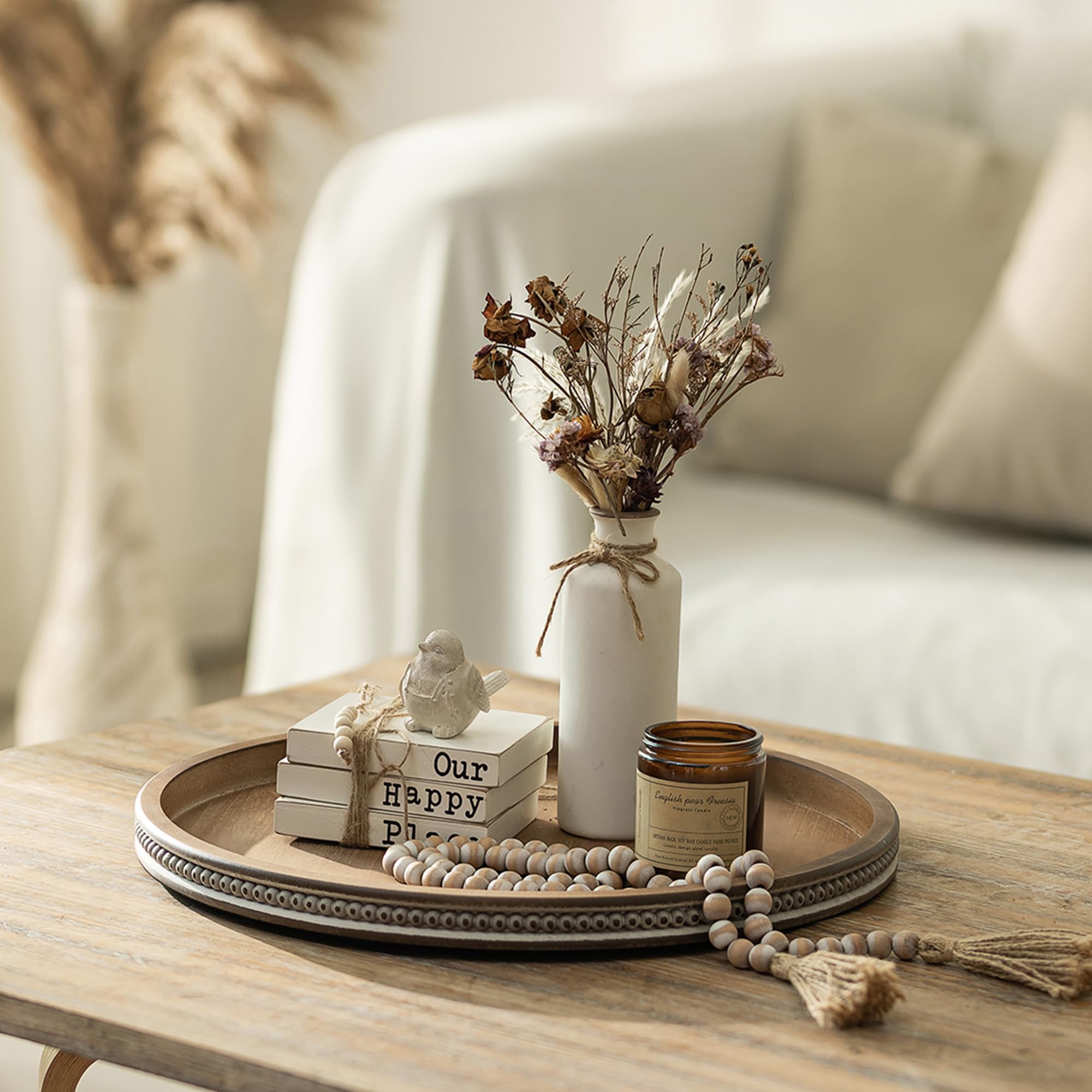 Hanobe farmhouse round tray with white-washed beads enhances neutral interiors.