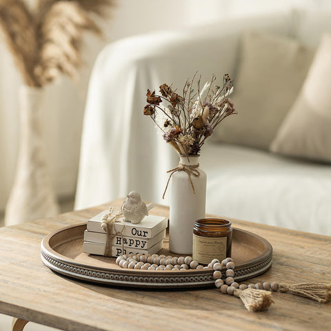 Hanobe farmhouse round tray with white-washed beads enhances neutral interiors.