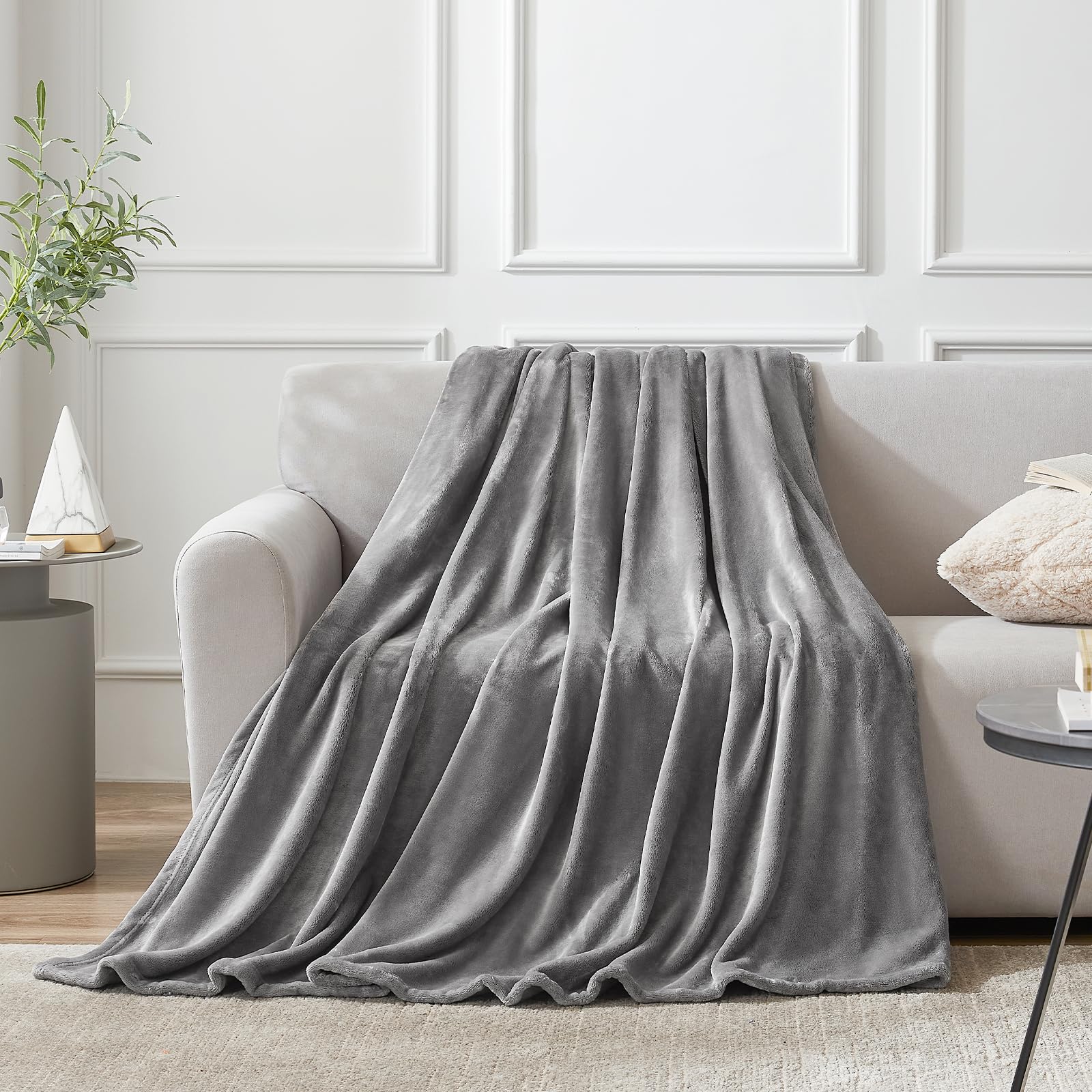 Hansleep fleece queen blanket in gray draped on bed for calming decor