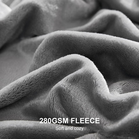 Hansleep blanket draped on sofa enhances decor and comfort.