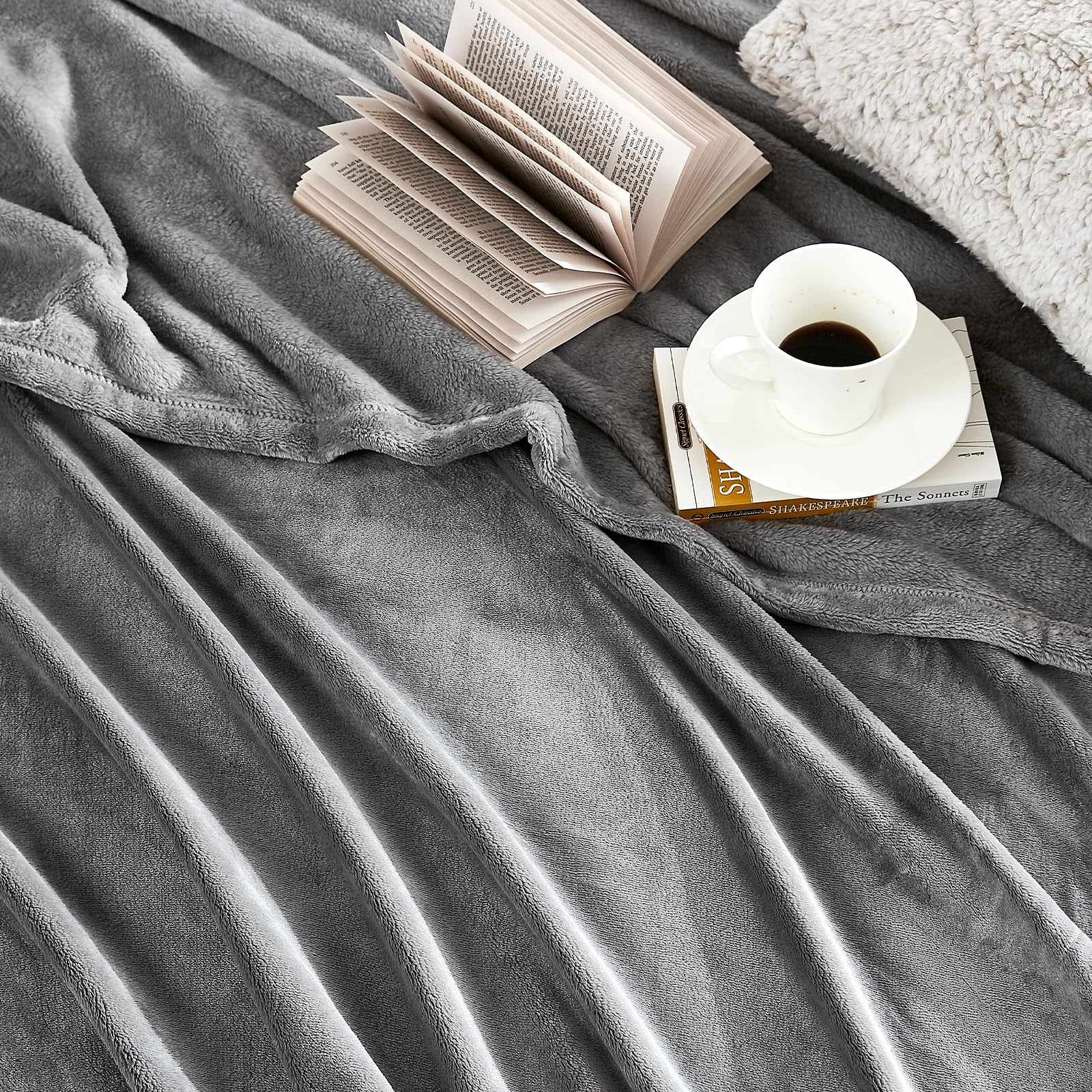 Hansleep versatile throw for bed, couch, or travel.