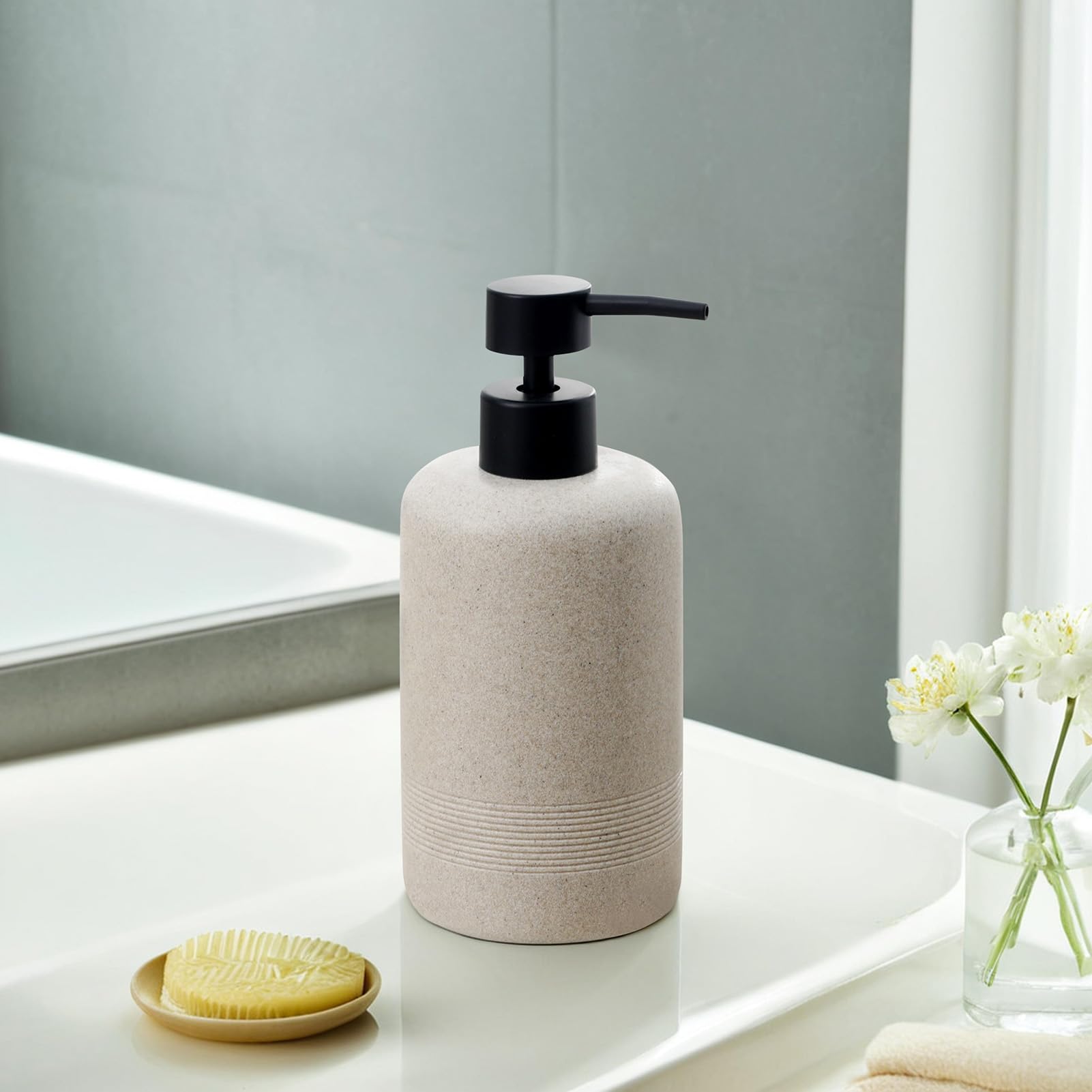 Dispenser on bathroom counter showing drip-free pump design.