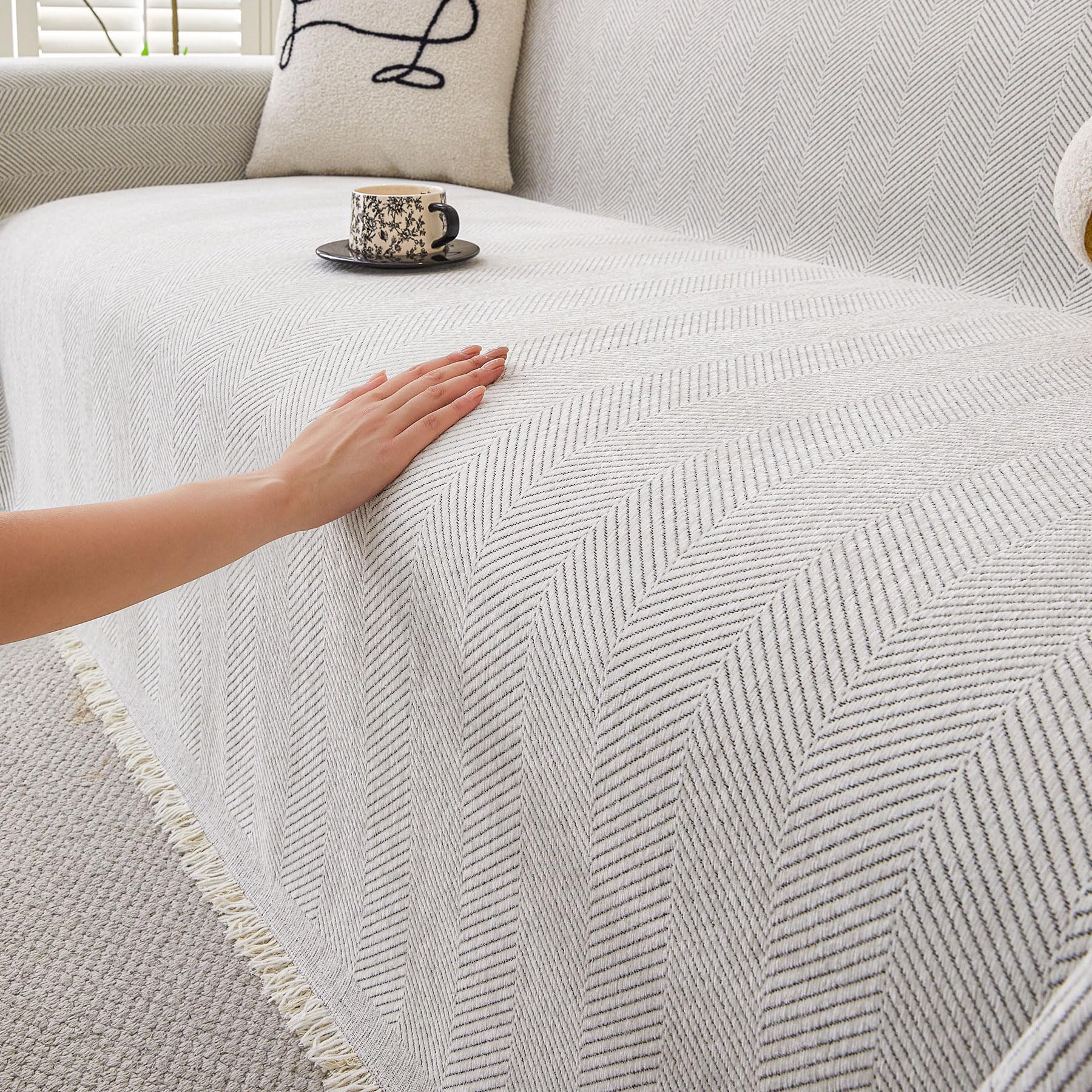 HAOMAIJIA non-slip couch cover on a 3-cushion sofa showing secure fit and protection
