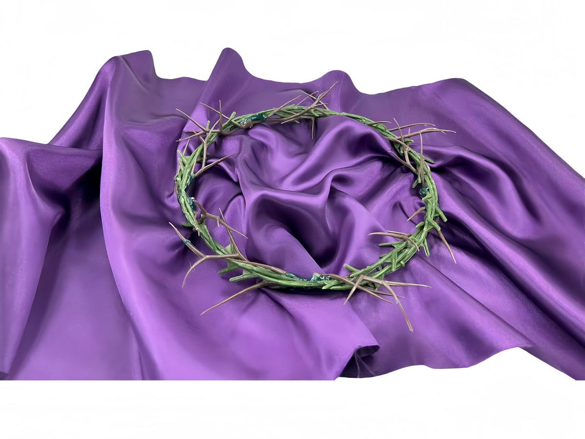 HAOST crown of thorns on purple satin fabric for solemn church or home display.