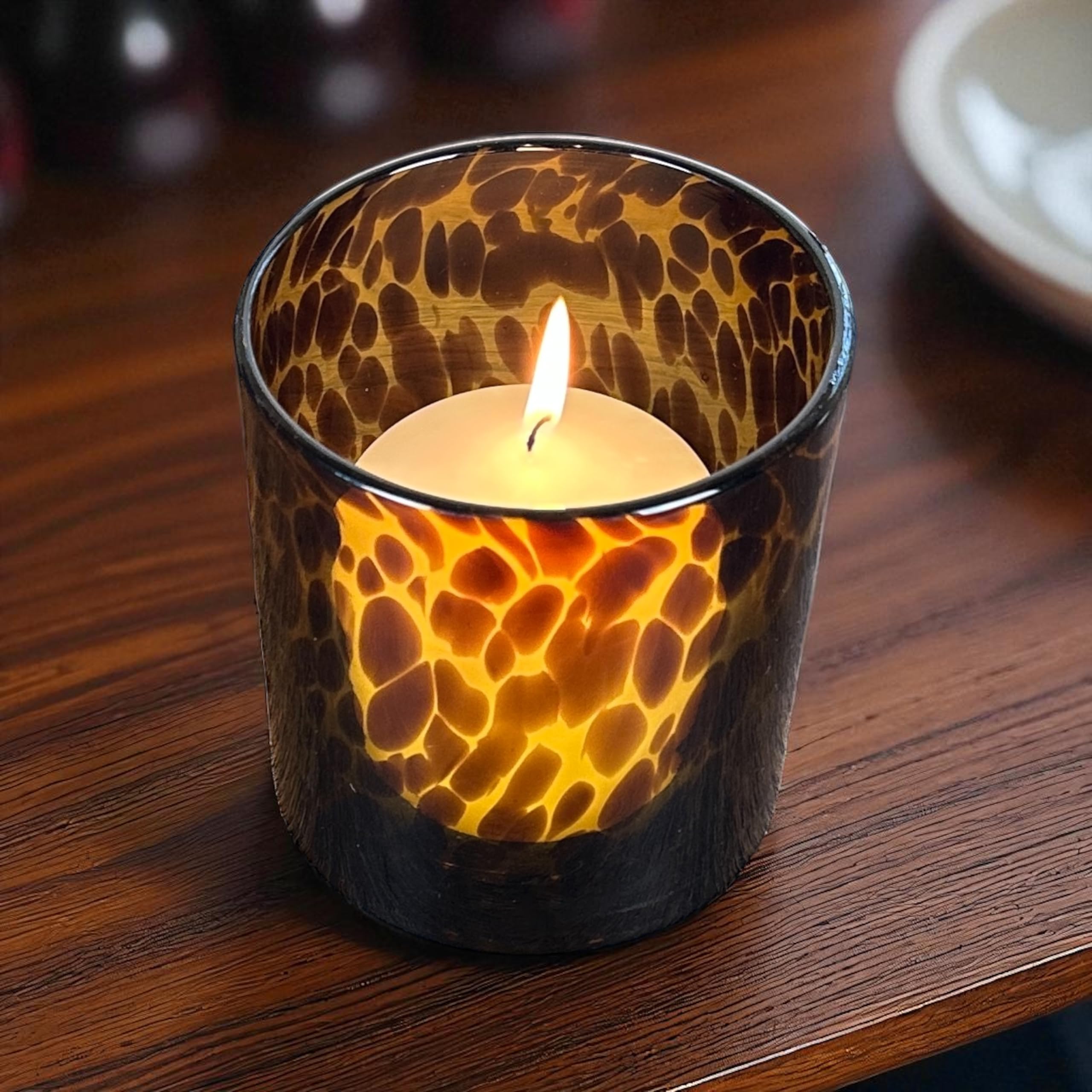 Hapton House tortoise-shell glass holder designed for votive and small pillar candles.