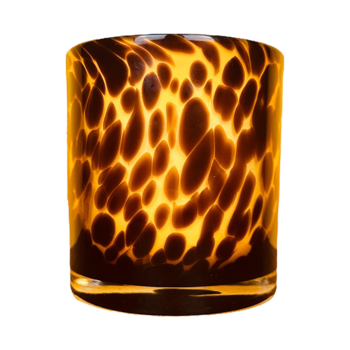Hapton House tortoise-shell glass candle holder with warm, elegant ambience.