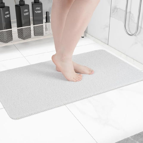 Hargiis non-slip bathtub mat on tub floor for safer stepping.