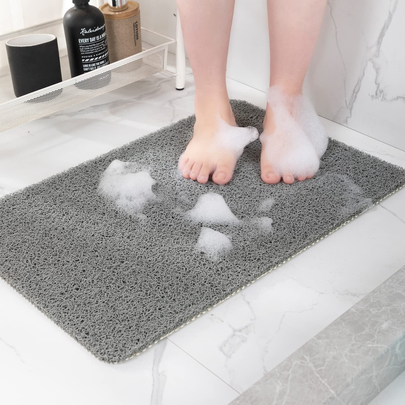 Hargiis non-slip shower mat in grey, 40x16 for secure footing.