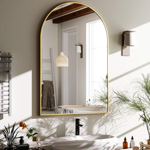 HARRITPURE arched mirror with gold frame enhances bathroom luxury and light.