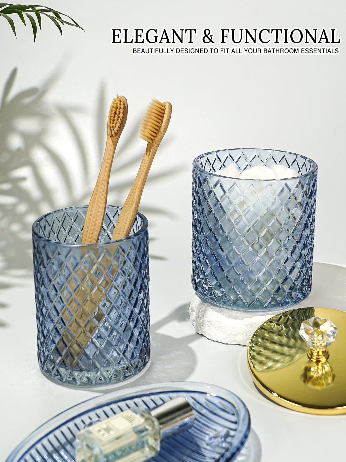 Haturi blue glass qtip holder stores cotton swabs for quick organization.