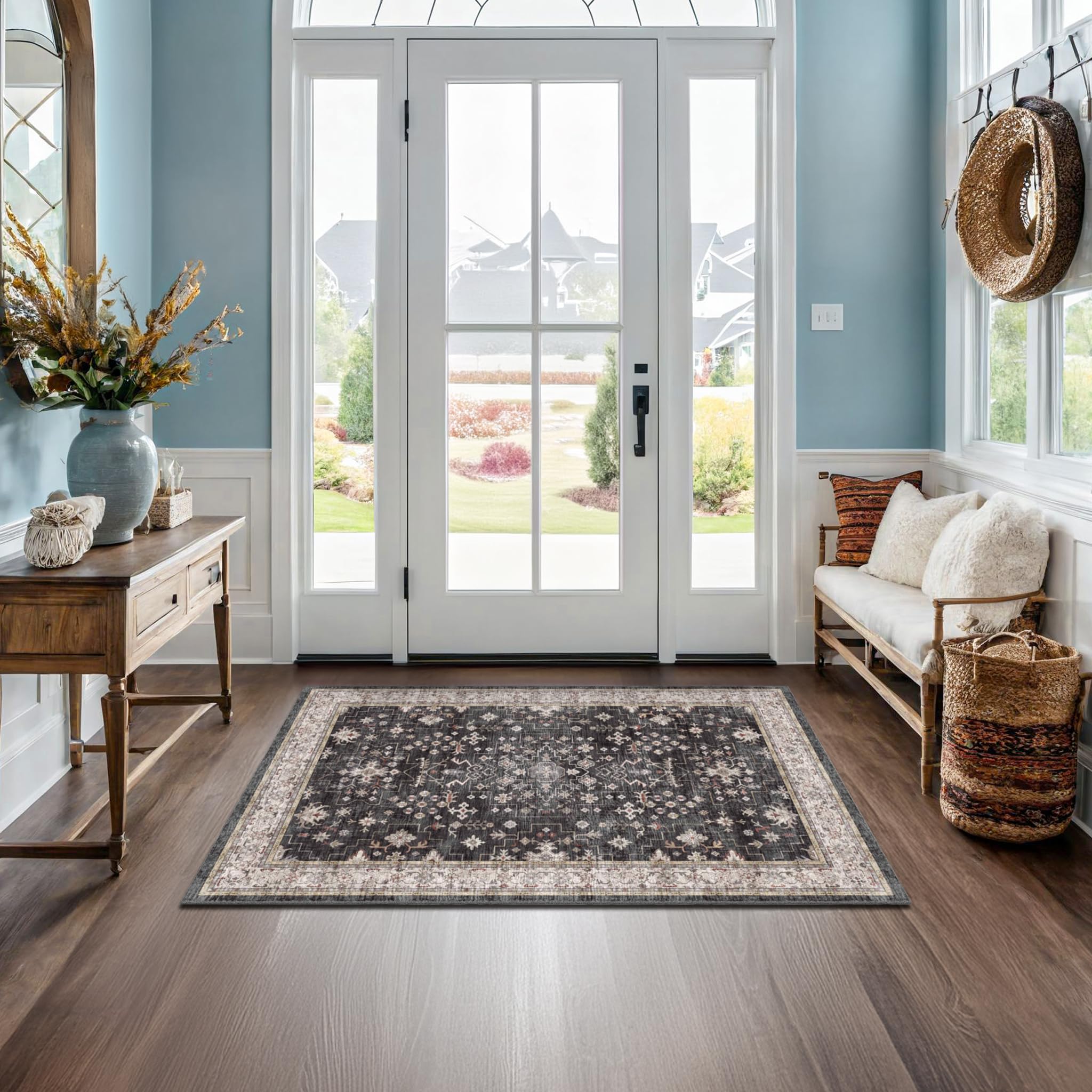 Hazo Haus Black Boho Entry Rug front view showing non-slip backing for secure placement.