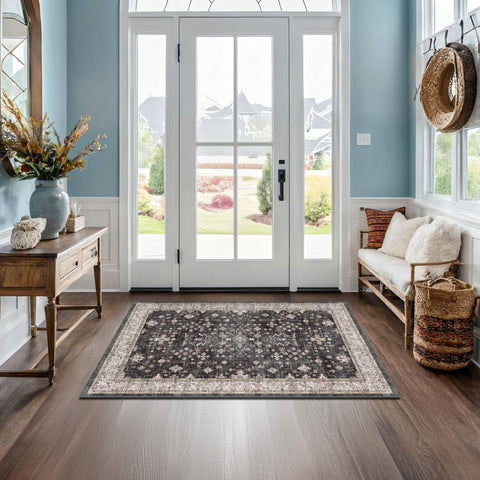 Hazo Haus Black Boho Entry Rug front view showing non-slip backing for secure placement.