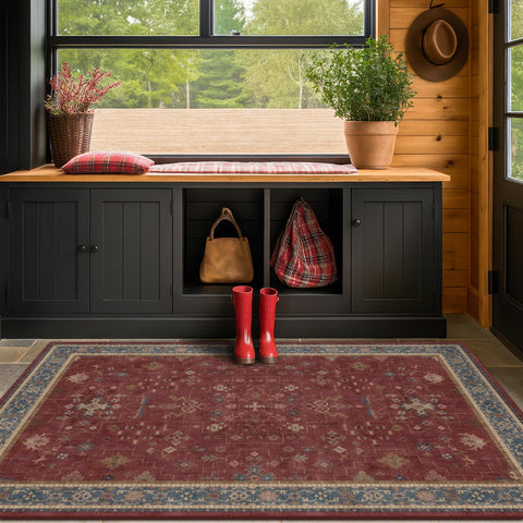Hazo Haus border floral medallion rug with navy and cream tones.