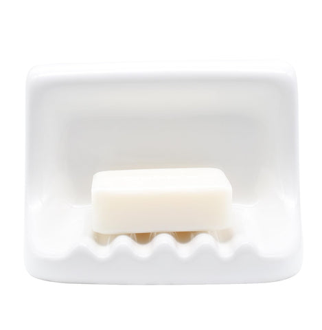 Hazzga soap dish on shower wall with vintage ceramic finish for easy soap access.