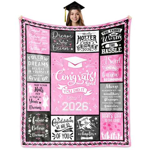 HCDER 2026 graduation blanket unfolded on sofa for cozy study sessions