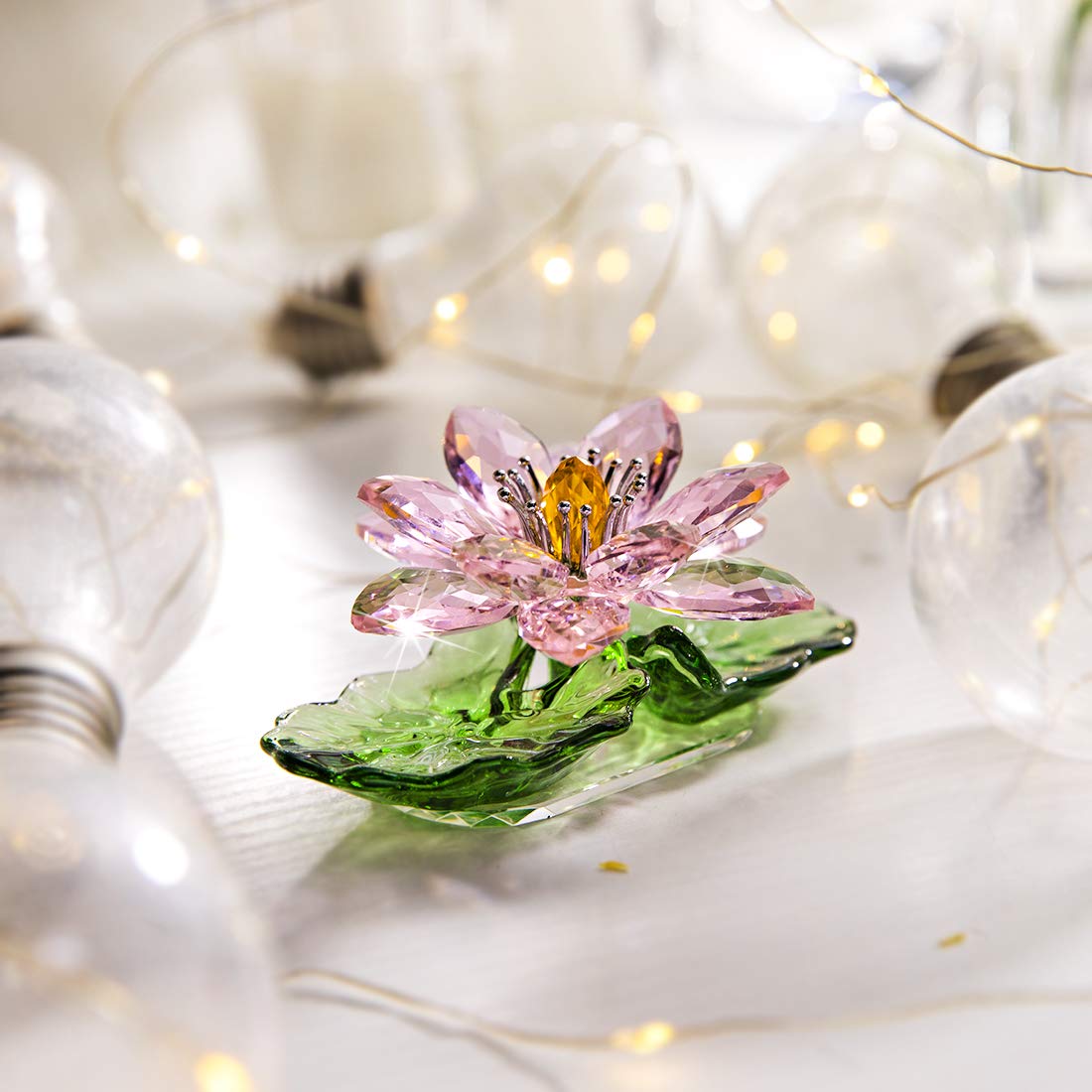 H&D HYALINE & DORA hue reflection crystal lotus creates rainbow prisms in living rooms.