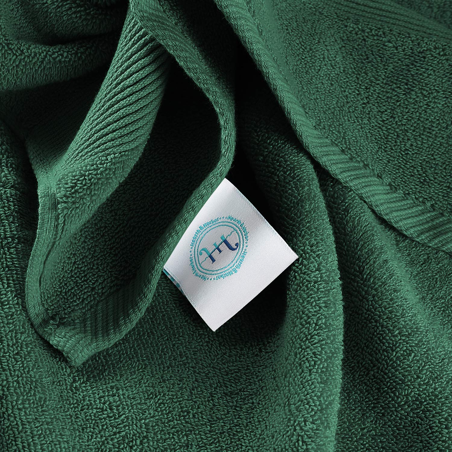 Hearth & Harbor hunter green towel stack adds elegant bathroom color.