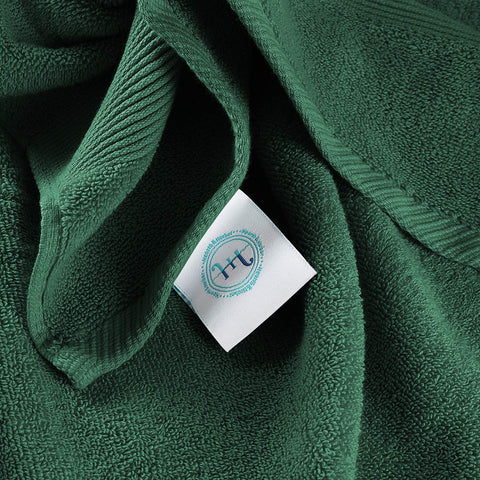 Hearth & Harbor hunter green towel stack adds elegant bathroom color.