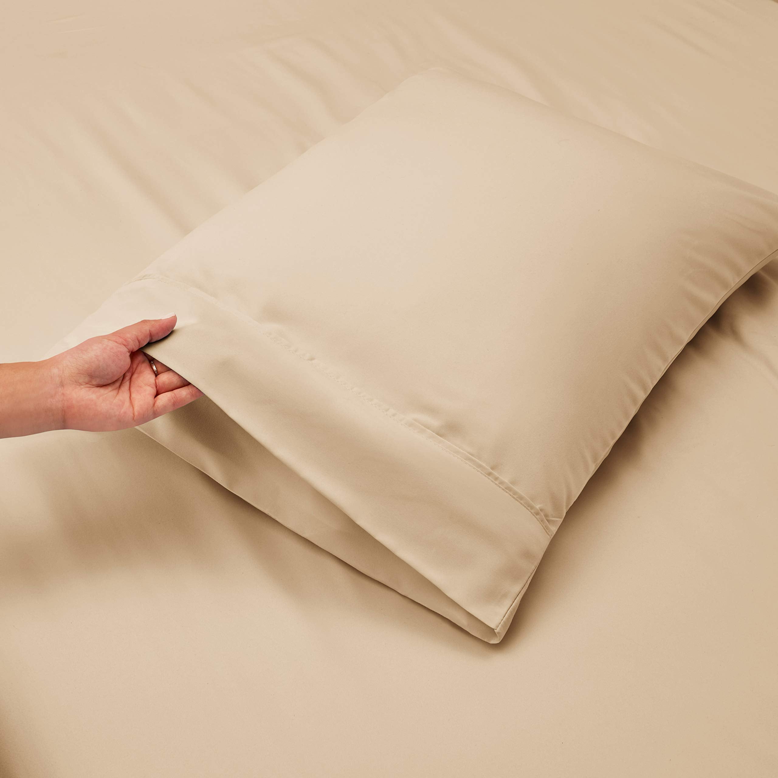 Hearth & Harbor bed linen set on a bed with a tall mattress showing deep-pocket fit