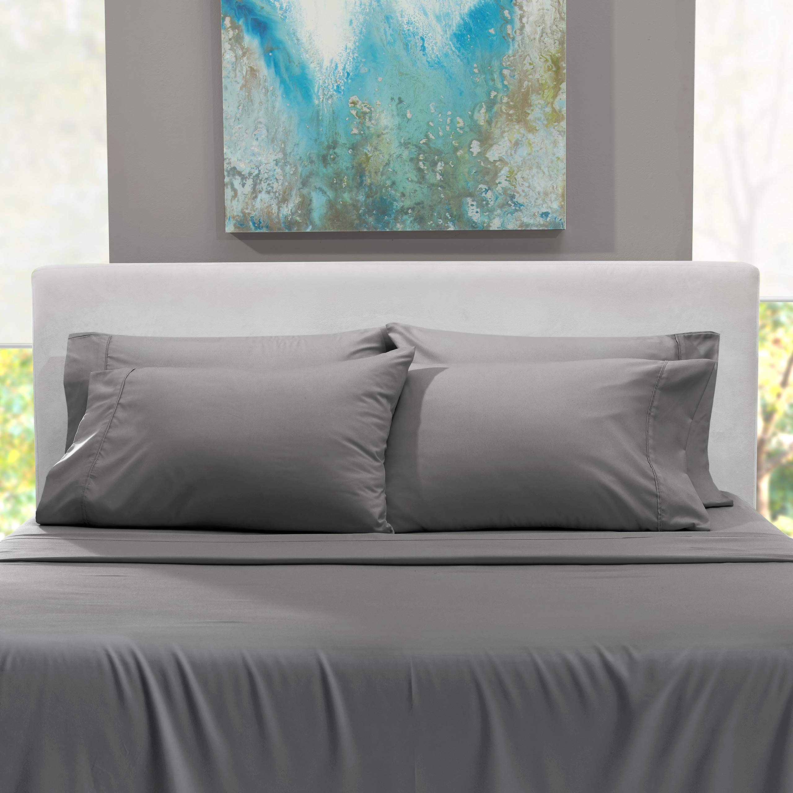 Cozy bedroom scene featuring Crisp Hearth and Harbor sheets in gray