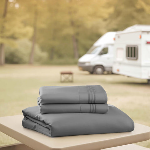 Hearth & Harbor flat sheet laid flat on camper bed, 99x90 size ready for RV use.