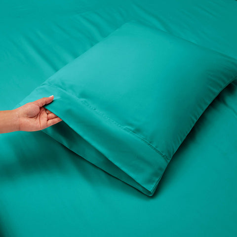 Care guide image for Hearth & Harbor teal sheets showing cold wash and low tumble dry.