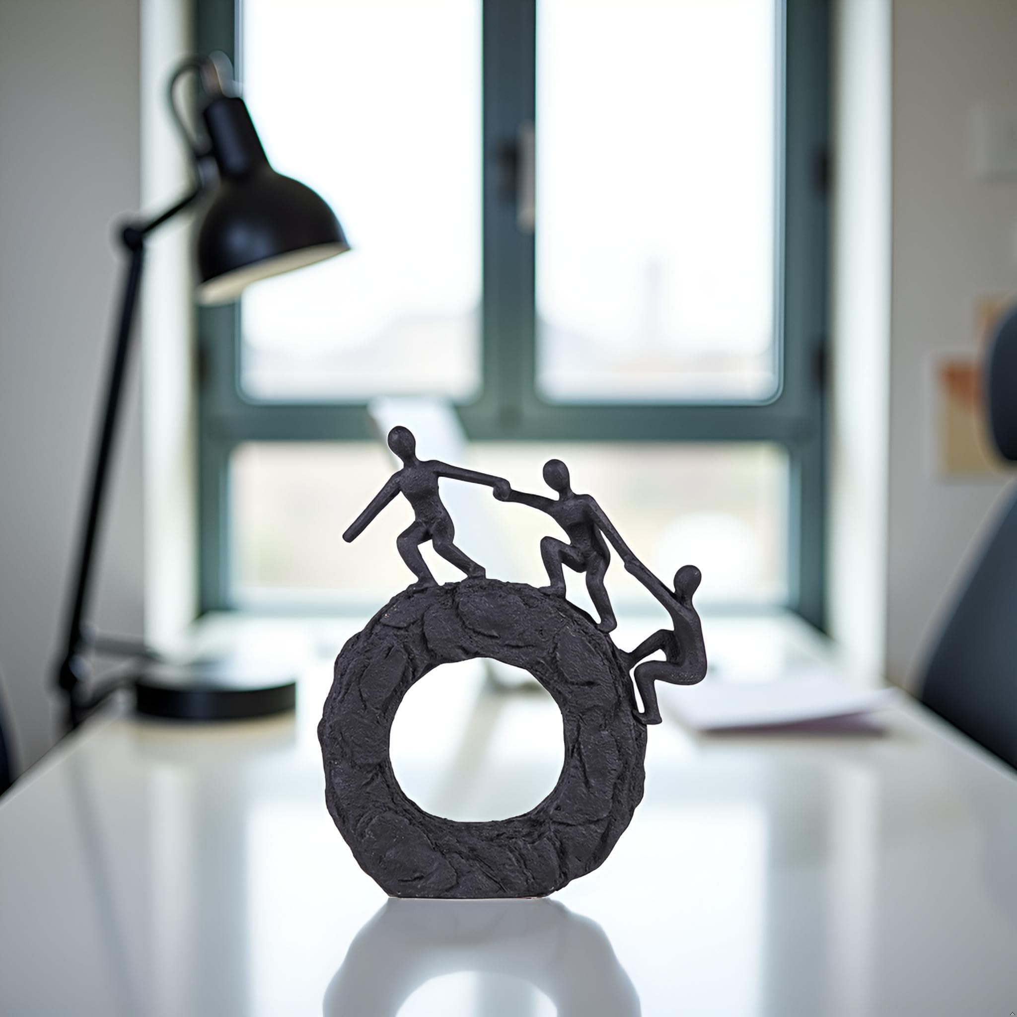Hebdids textured matte black finish sculpture enhances room depth.