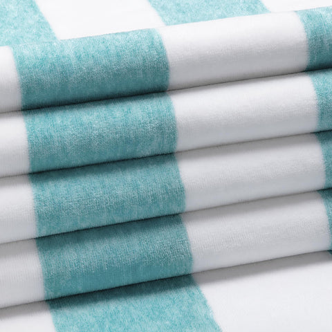 Henbay turquoise striped towel laid on sand for sunny days