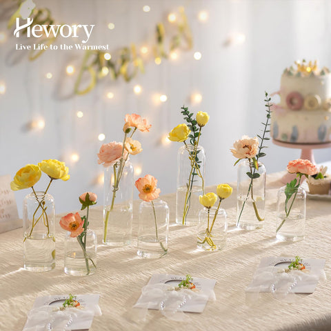 Hewory glass bud vases in four heights create versatile tablescapes.