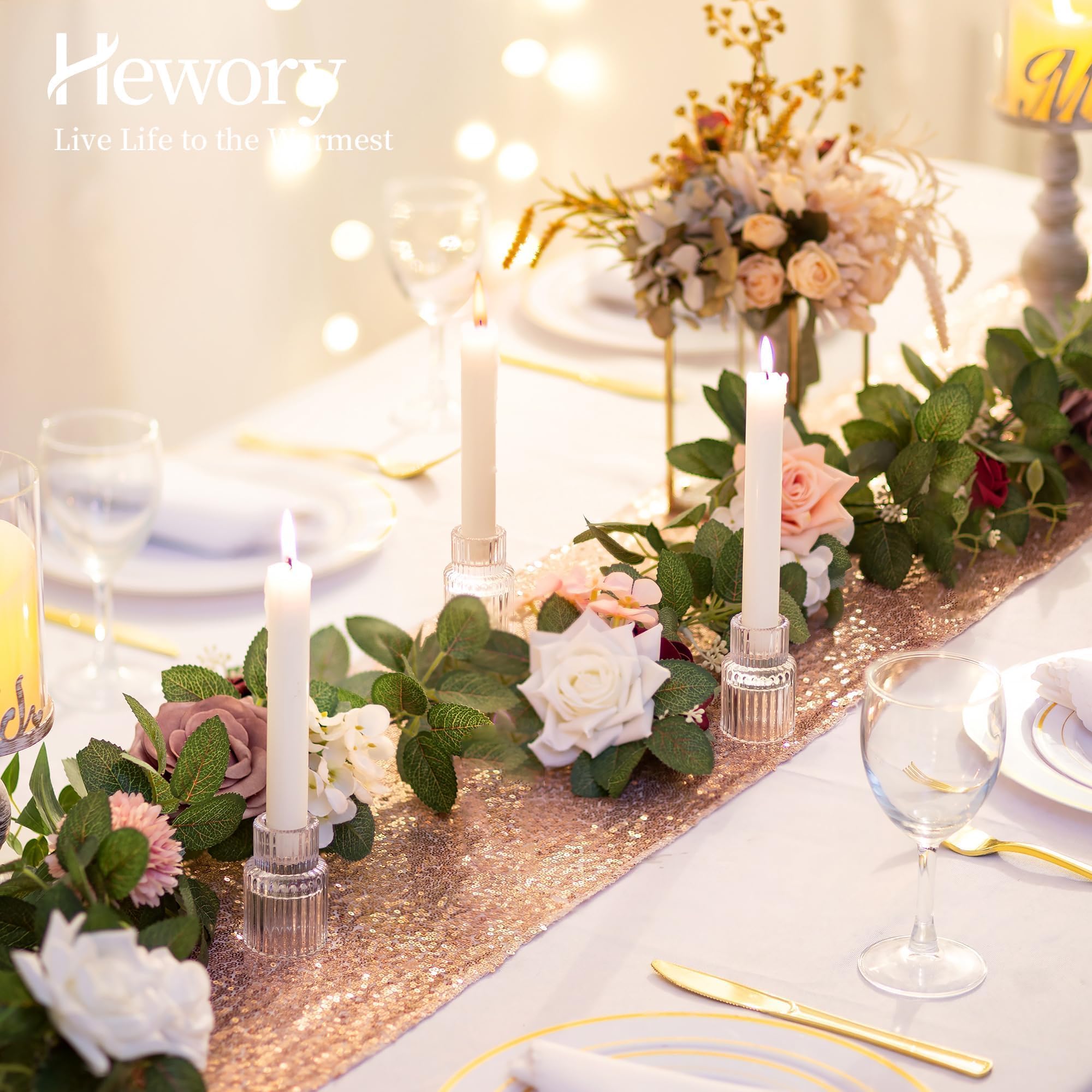 Hewory glass candle stick holder enhances wedding decor.