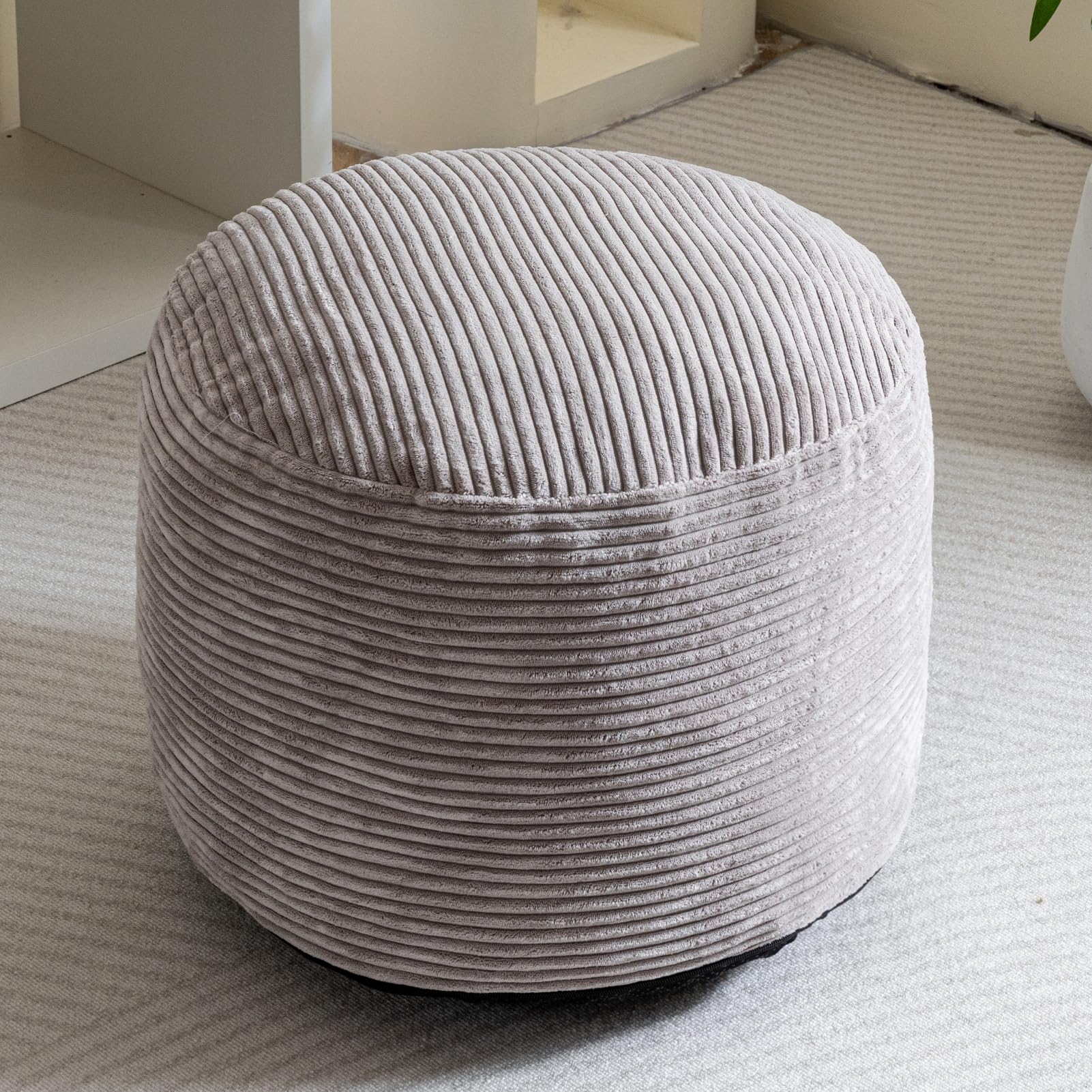 HIGOGOGO pouf provides seating and light storage in grey.