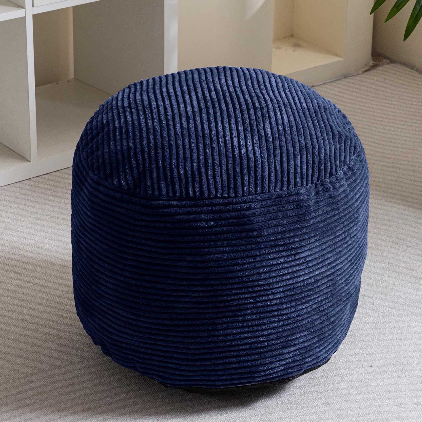 HIGOGOGO pouf serves as storage for towels and blankets.