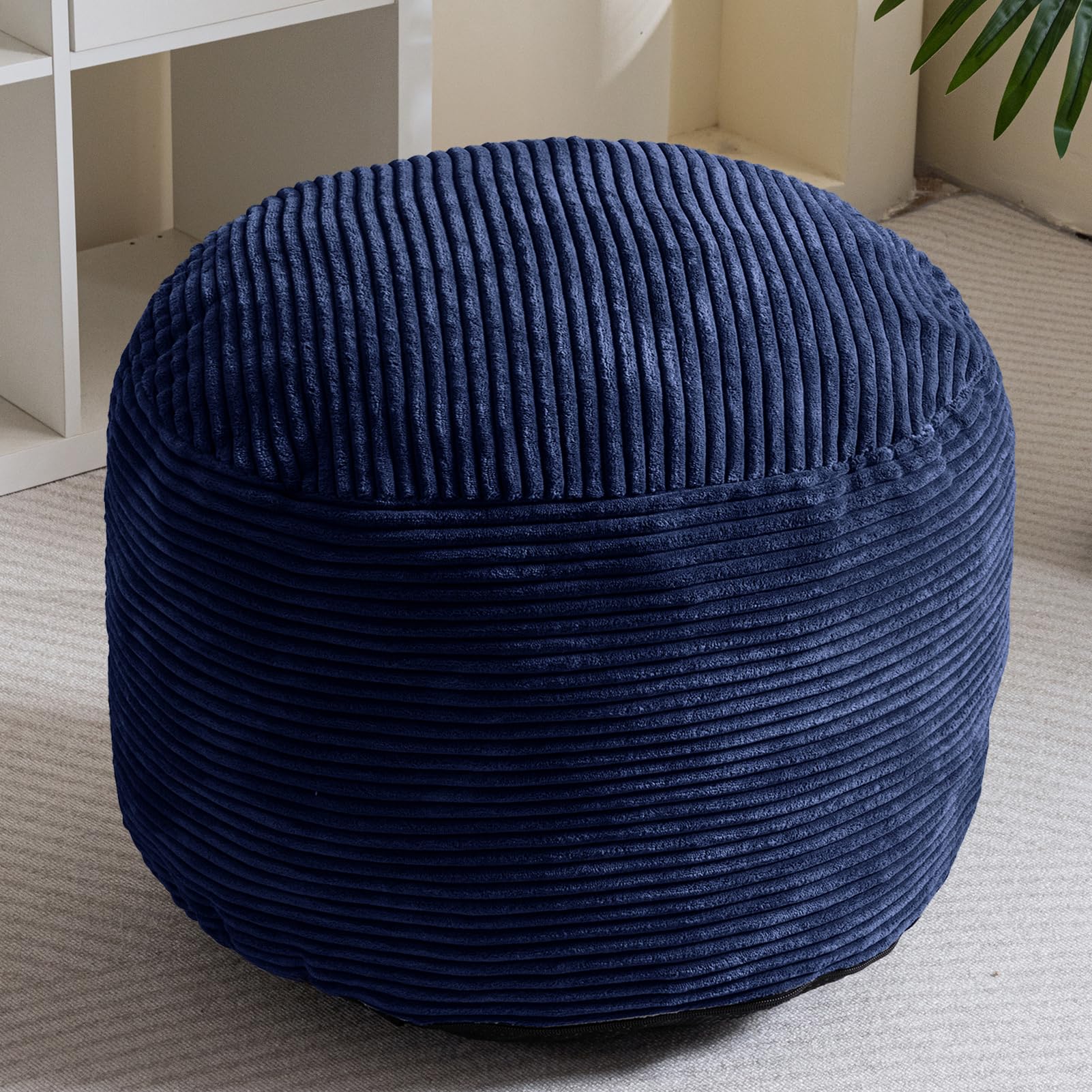 HIGOGOGO navy plush round pouf texture invites relaxing moments.