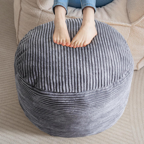 HIGOGOGO round corduroy pouf ottoman with dark grey fabric, ideal as a footrest.