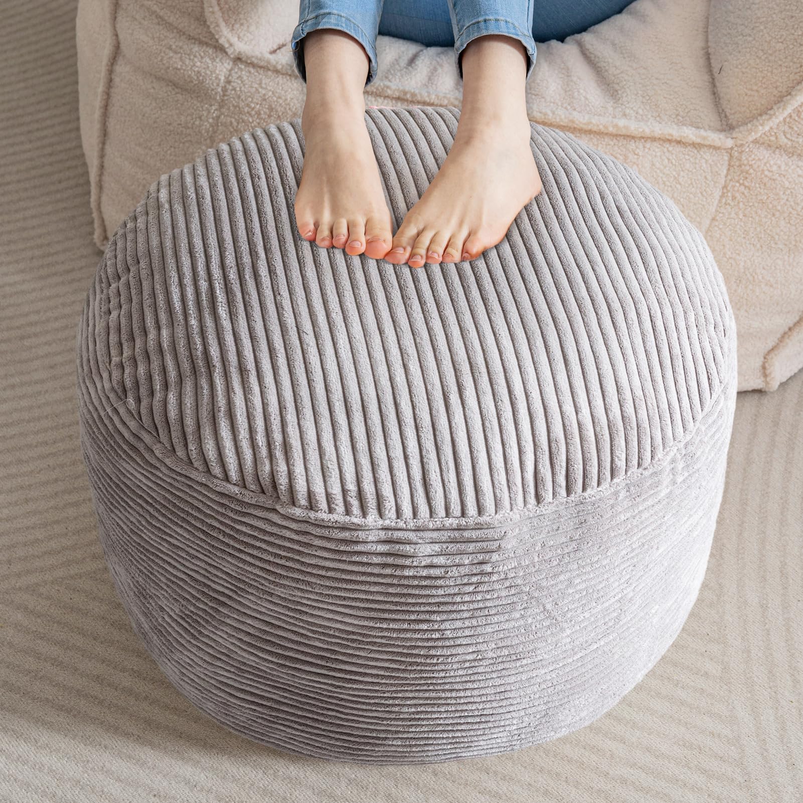 HIGOGOGO round stuffed pouf ottoman in grey offers versatile foot rest.