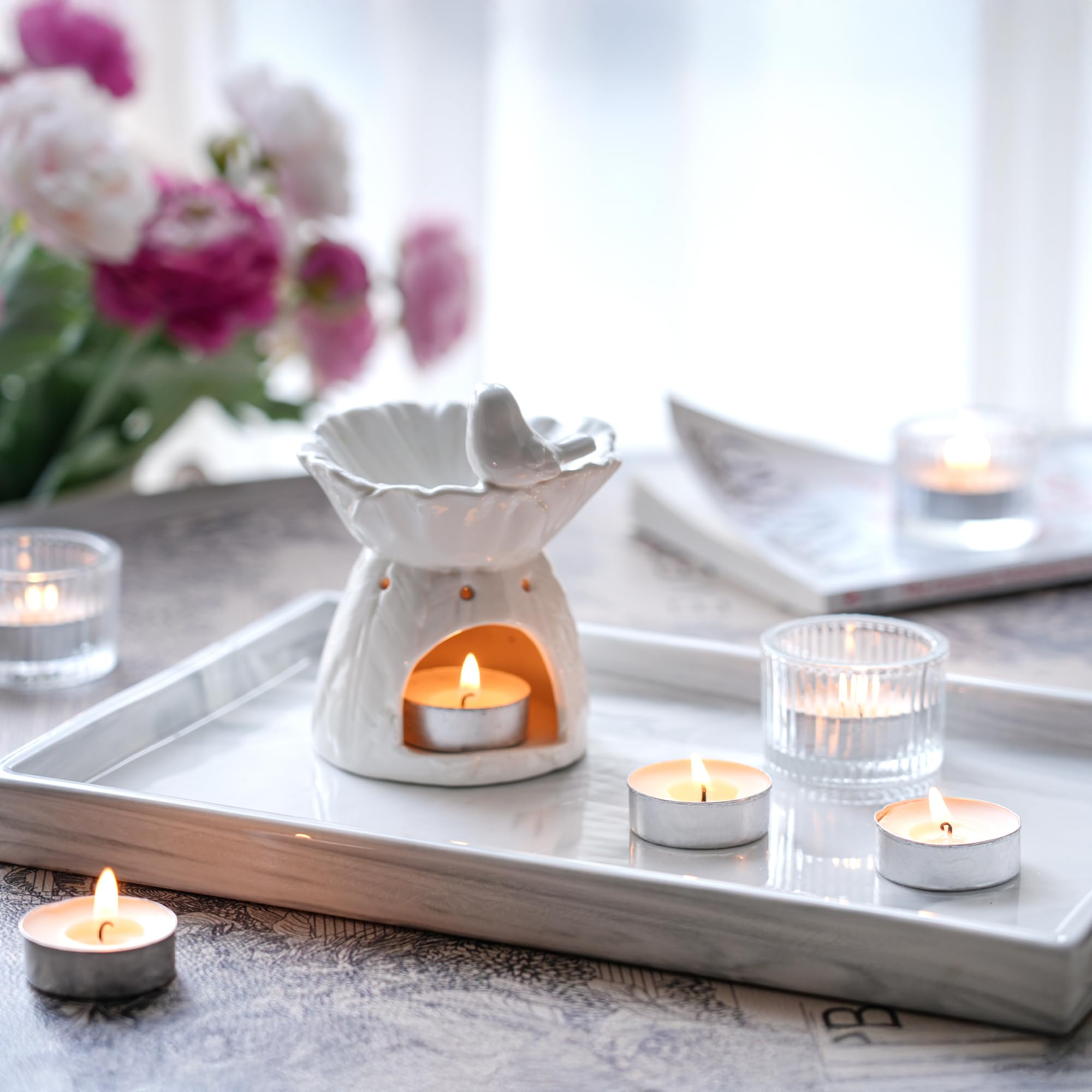 HILUMIDA tea lights on a dinner table with warm, long-lasting light
