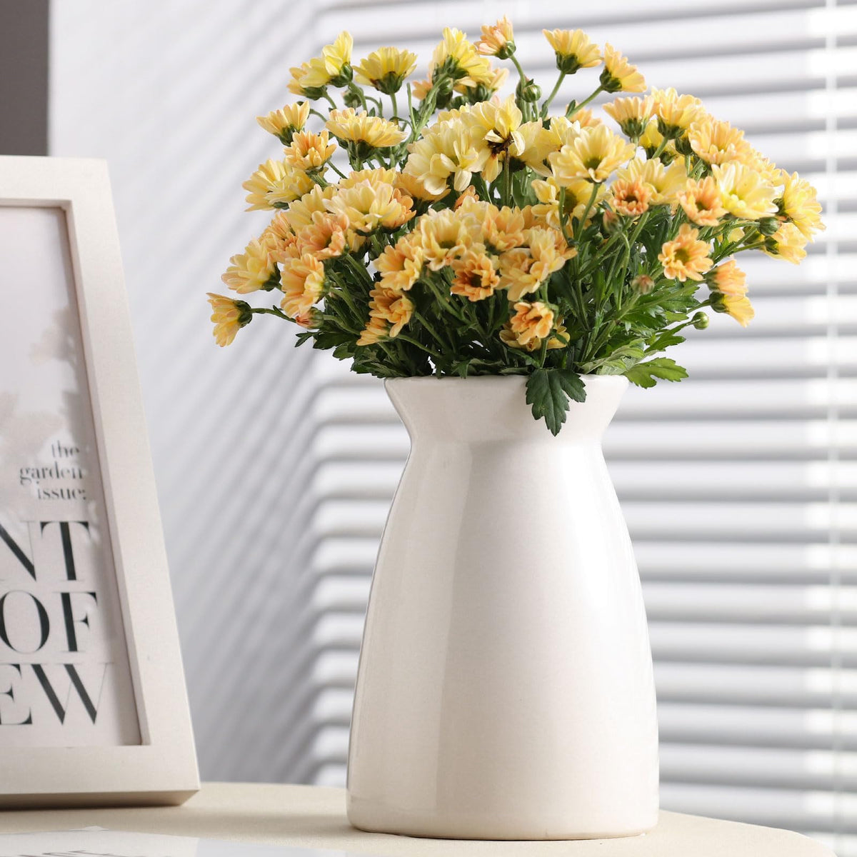 HJN white ceramic flower vase, perfect as a centerpiece for living spaces.