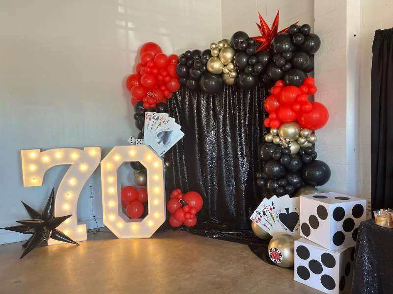 HKYOOD red and black balloons reinforce Las Vegas theme.