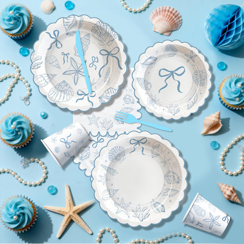 HOAKWA ocean tablecloth provides a cohesive coastal backdrop.