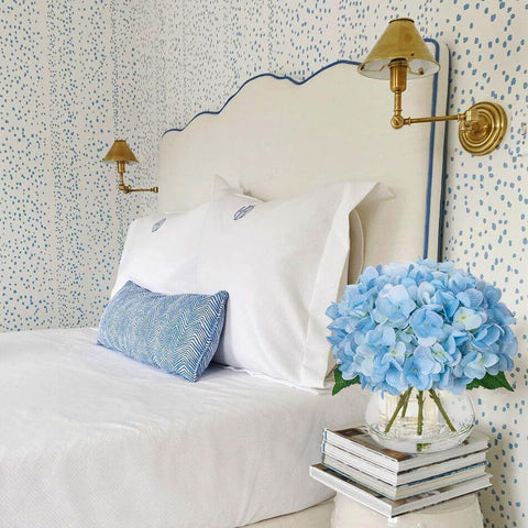 Hollyone hydrangea bouquet in clear vase inspires warm, inviting spaces.
