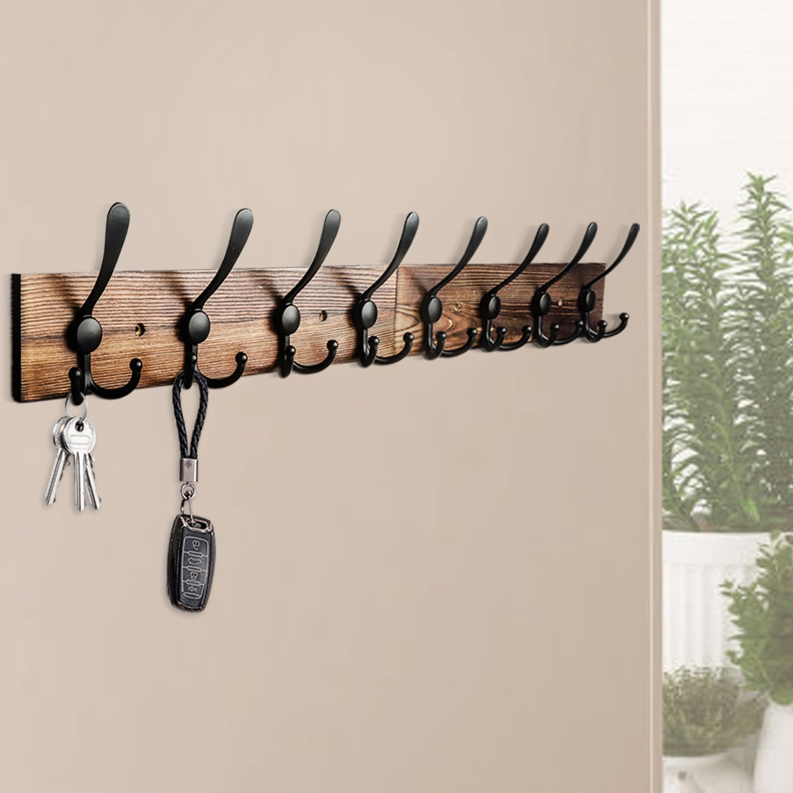 Coat rack provides stable wall storage that keeps essentials reachable and organized.