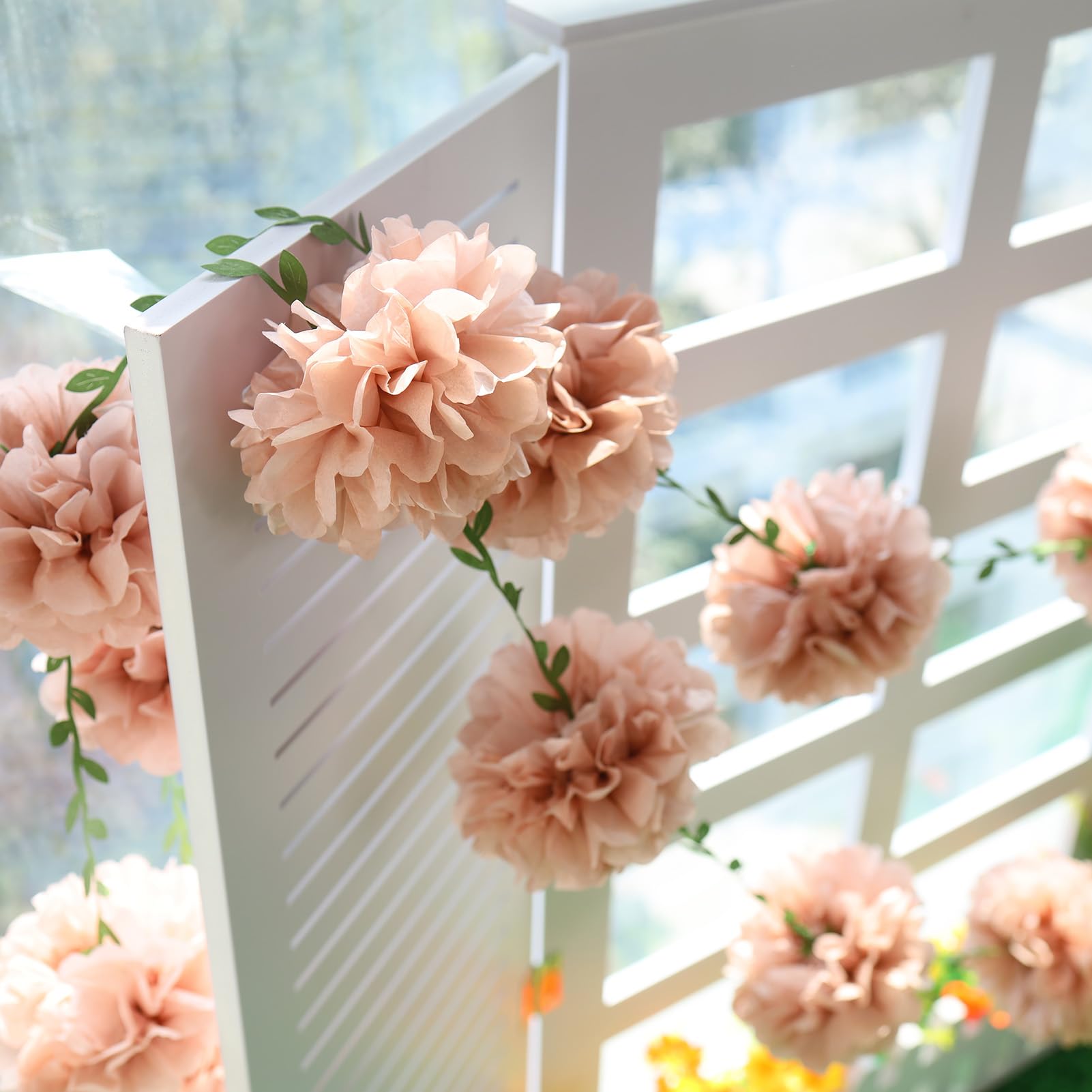 Homarkable soft tissue pom pom display adds light, airy volume to indoor celebrations.