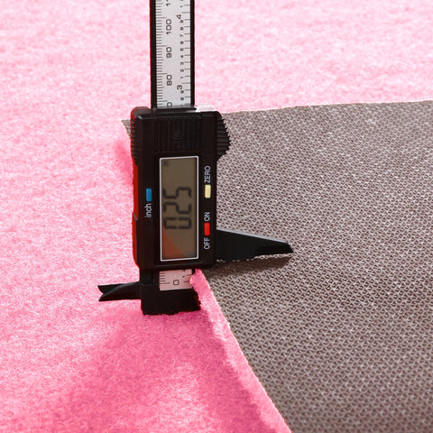 HOMBYS pink carpet runner rolled for compact storage after use.